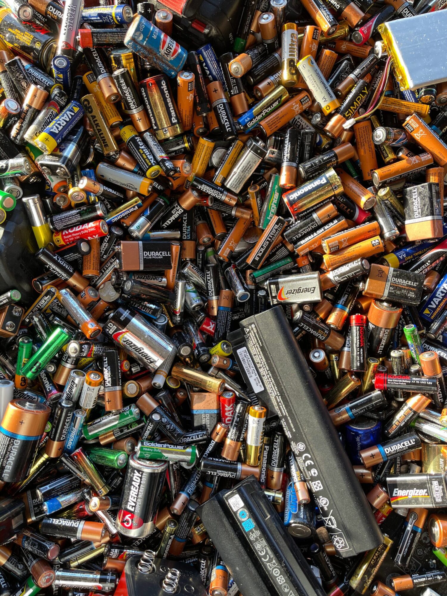 a lot of disposable batteries ready for recycling | Disposable vs Rechargeable batteries