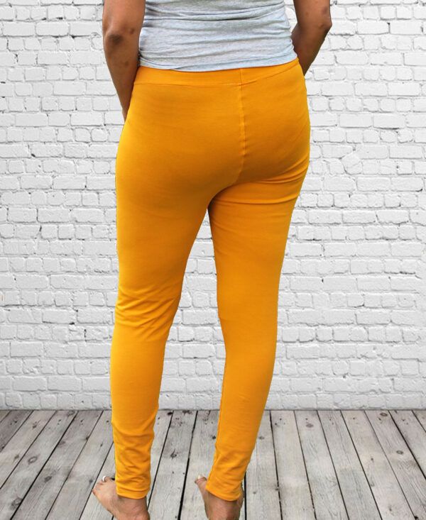 workout leggings Mustard with wall background back view