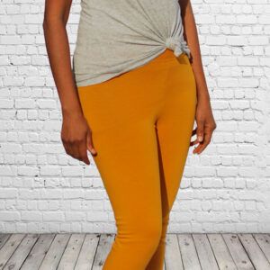 workout leggings Mustard with wall background cropped