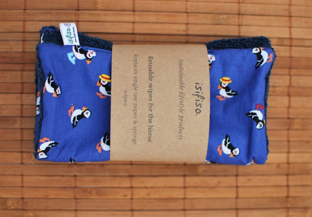 Home wipe with puffins on blue background packaged