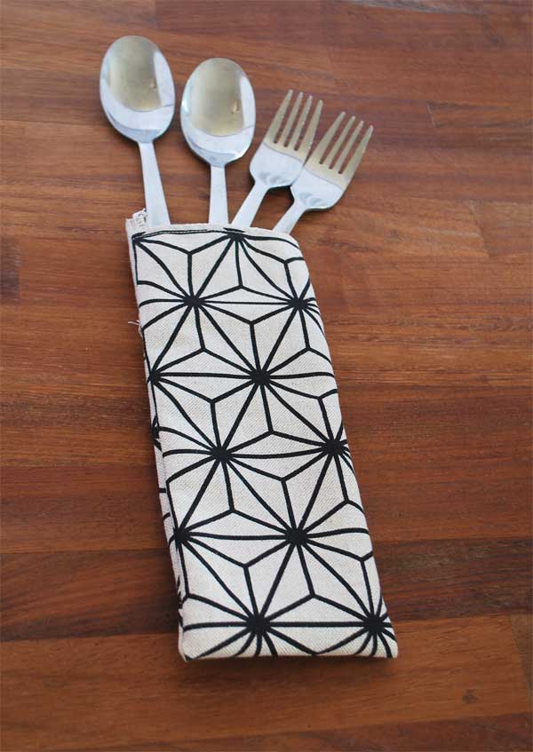 cutlery bag with geometric print on beige with cutlery - eco friendly product made from rescued fabrics - isifiso