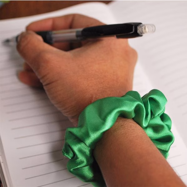 How to Sew a Scrunchie: A Complete Step-by-Step Guide 2 sew a scrunchie,sew a scrunchie step by step,free scrunchie pattern Green scrunchie on hand 1 jpg sew a scrunchie,sew a scrunchie step by step,free scrunchie pattern