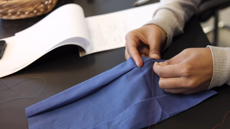 Creative Corporate Team events | Work Events London 15 closeup Clothes Mending Class Team Building event Eco friendly activity 768x432